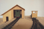 Engine shed, loco and passenger car Engine shed, loco and passenger car